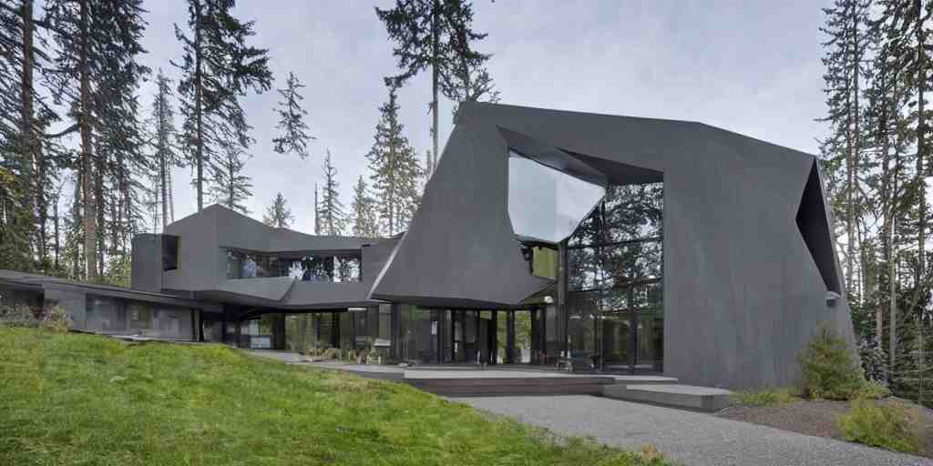 large futuristic residence, pacific northwest, gray concrete, large windows, angular features, incorporating metal