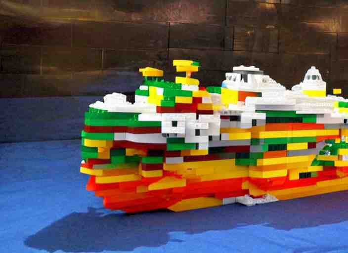 a real life-sized boat made out of translucent LEGO bricks.